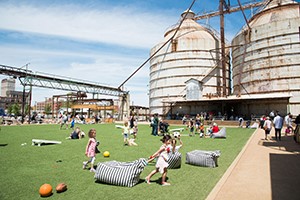 Kids playing beside the Waco silos.