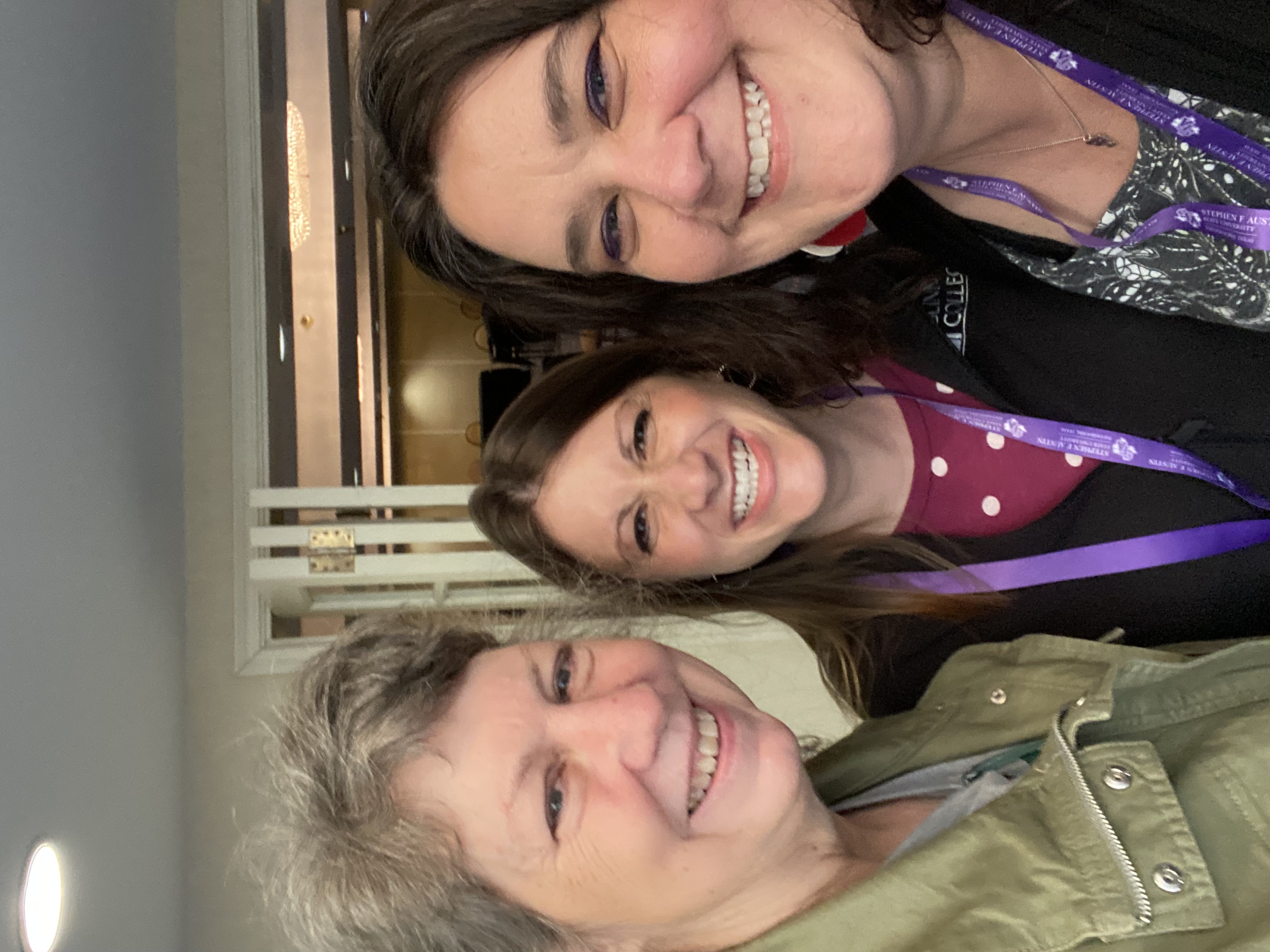 Three women smiling