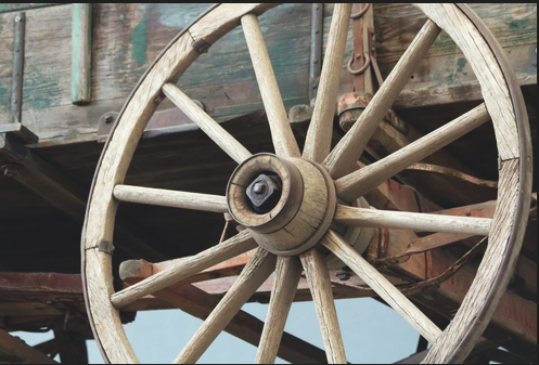 Photo of a brown wooden 
wheel spoke