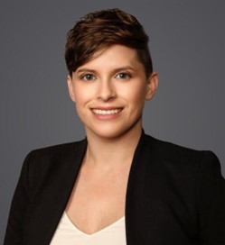 A professional picture of a woman with short, brown hair smiling.